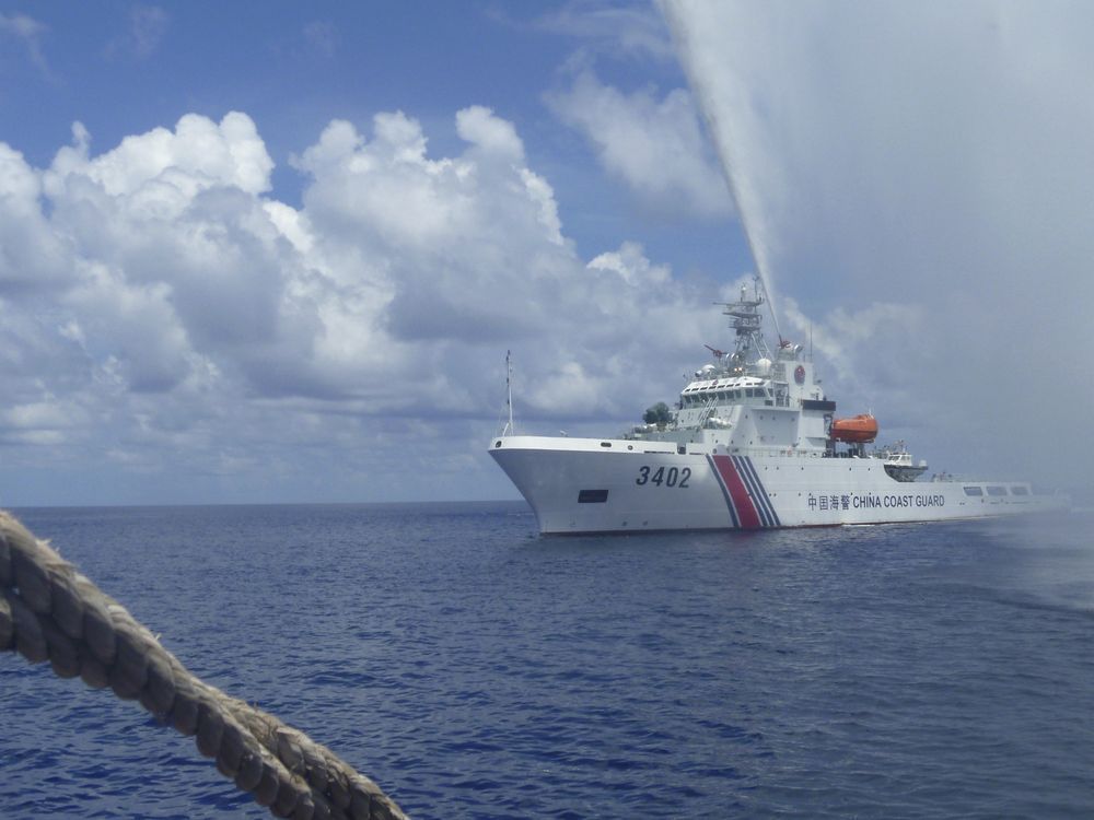 Chinese coast guard claims to have chased away Philippine navy ship from South China Sea shoal
